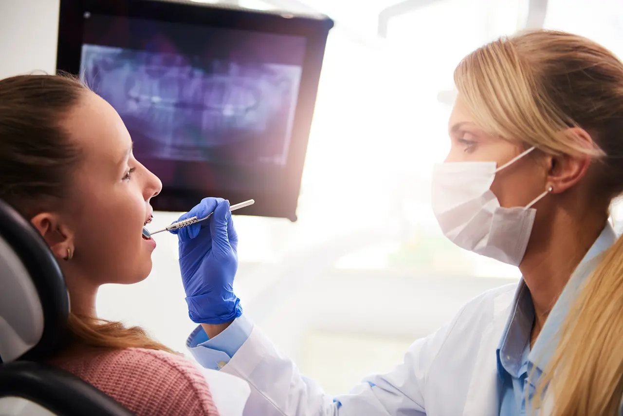 Jaw and airway evaluation for sleep apnea Dentist examining a patient’s mouth and jaw structure during an airway evaluation for sleep apnea