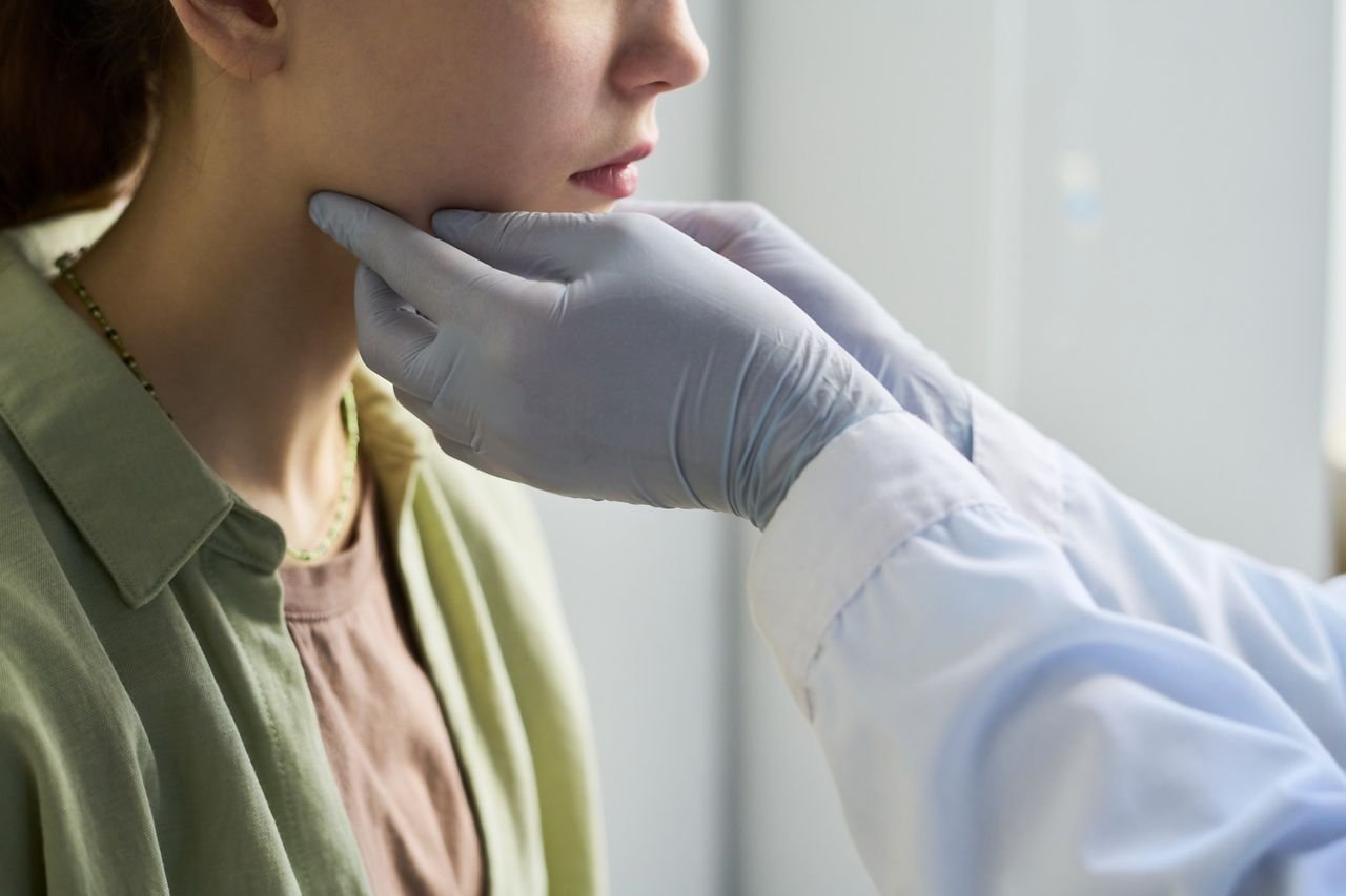 Palate width can affect more than the teeth Provider examining a patient's jaw at Breathing Wellness Orlando