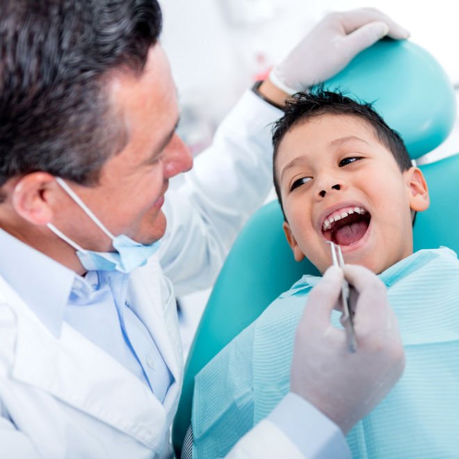 Child being fitted for an oral appliance